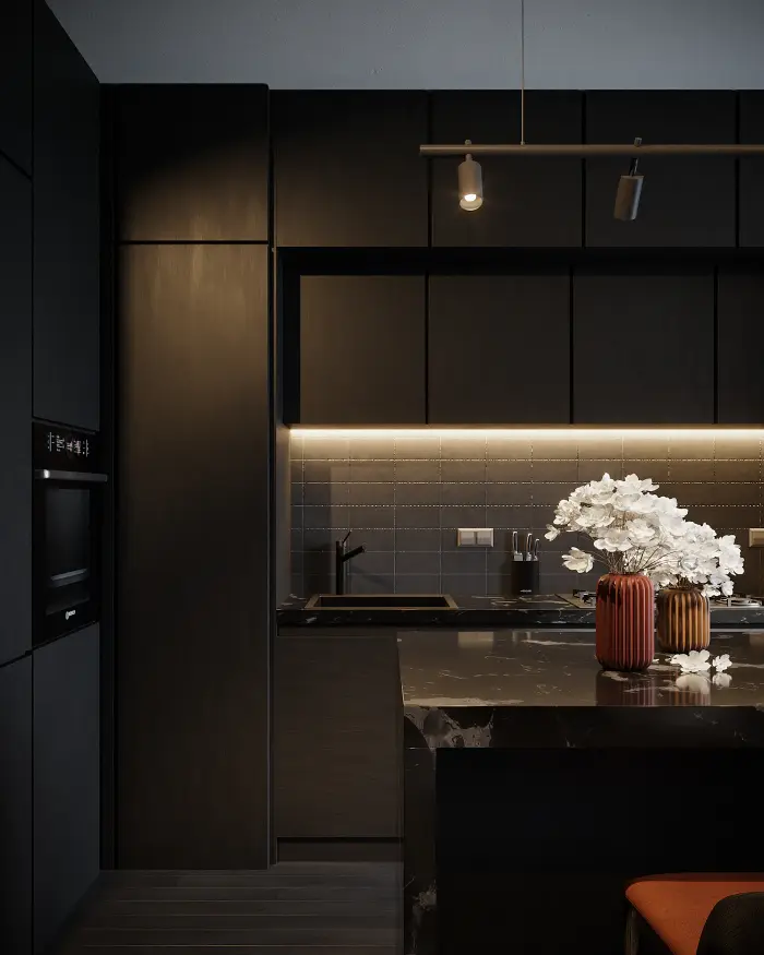 Dark modern kitchen with warm under-cabinet lighting